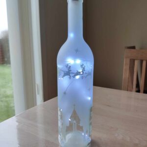 Lys flaske med julemotiver